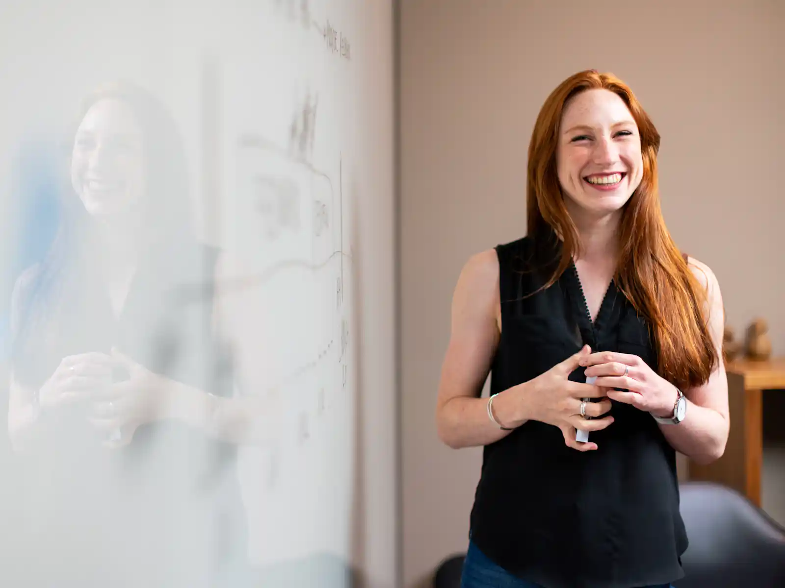 A WeBuild consultant presenting at a whiteboard